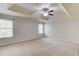 Spacious primary bedroom featuring neutral carpet and ceiling fan at 2045 Villa Spring Ct, Dacula, GA 30019