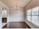 Formal dining room with hardwood floors and a chandelier at 2045 Villa Spring Ct, Dacula, GA 30019