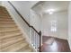 Inviting foyer with hardwood floors and staircase, providing a grand entrance at 2045 Villa Spring Ct, Dacula, GA 30019