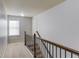 Hallway features neutral carpet and railings at 2045 Villa Spring Ct, Dacula, GA 30019