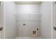 A utilitarian laundry room with grey walls and wire shelving at 2045 Villa Spring Ct, Dacula, GA 30019