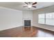 Bright living room featuring hardwood floors and a cozy fireplace at 2045 Villa Spring Ct, Dacula, GA 30019
