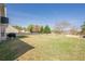 Expansive backyard featuring a lush lawn, mature trees, and a wooden fence at 2470 Cordillo Dr, Dacula, GA 30019