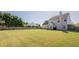 Spacious backyard showcasing a green lawn, fencing, and the home's exterior at 2470 Cordillo Dr, Dacula, GA 30019