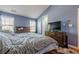 Vaulted ceiling bedroom with large windows offering natural light and a comfortable bed at 2470 Cordillo Dr, Dacula, GA 30019