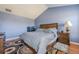 Comfortable bedroom with neutral walls, hardwood floors, and a comfortable bed at 2470 Cordillo Dr, Dacula, GA 30019