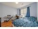 Cozy bedroom with hardwood floors, a desk area, and bright natural light at 2470 Cordillo Dr, Dacula, GA 30019