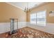 Bright dining room with chair rail, chandelier, and large window for natural light at 2470 Cordillo Dr, Dacula, GA 30019