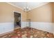 Traditional dining room with chair rail, a chandelier, hardwood floors, and access to the kitchen at 2470 Cordillo Dr, Dacula, GA 30019