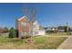 Lovely two-story home with a brick facade, manicured lawn, and an attached garage at 2470 Cordillo Dr, Dacula, GA 30019