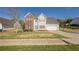 Beautiful two-story home with a well-kept lawn, a two-car garage, and a welcoming entrance at 2470 Cordillo Dr, Dacula, GA 30019