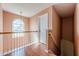 Upstairs hallway with hardwood floors, natural light, and access to bedrooms at 2470 Cordillo Dr, Dacula, GA 30019