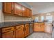 This kitchen features wood cabinets, granite countertops, and stainless steel appliances at 2470 Cordillo Dr, Dacula, GA 30019