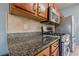 The kitchen features granite countertops, a gas range, and stainless steel appliances at 2470 Cordillo Dr, Dacula, GA 30019