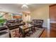 This open living room features hardwood floors, neutral paint, and comfortable leather couches at 2470 Cordillo Dr, Dacula, GA 30019