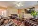 Welcoming living room with large tv, hardwood floors, and comfortable dark brown leather couches at 2470 Cordillo Dr, Dacula, GA 30019