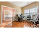 A home office featuring beautiful hardwood floors, neutral walls, and ample lighting at 2470 Cordillo Dr, Dacula, GA 30019