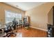 A home office featuring beautiful hardwood floors, neutral walls, and ample lighting at 2470 Cordillo Dr, Dacula, GA 30019