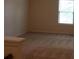Bedroom featuring neutral walls and carpet, with a bright window allowing natural light at 4265 Almanor Cir, Norcross, GA 30071
