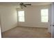 Spacious bedroom with neutral walls, carpet flooring, and natural light from windows at 4265 Almanor Cir, Norcross, GA 30071