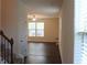 Inviting living room with large windows and a ceiling fan providing ample light at 4265 Almanor Cir, Norcross, GA 30071
