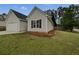 Charming home with a manicured lawn, complemented by a well-maintained two-car garage at 100 Chartres St, Dallas, GA 30157