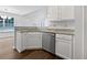 Kitchen featuring stainless steel dishwasher, sink, and granite countertops at 100 Chartres St, Dallas, GA 30157