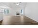 Spacious living room features a fireplace, neutral paint, large windows, and hardwood floors at 100 Chartres St, Dallas, GA 30157