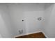 Bare laundry room shows the hookups in the wall at 2021 Emerald Dr, Loganville, GA 30052
