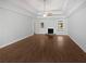Bright and spacious living room with fireplace, hardwood floors, and natural light at 2021 Emerald Dr, Loganville, GA 30052