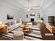 Bright, neutral living room with fireplace, ample seating, and modern decor at 2021 Emerald Dr, Loganville, GA 30052