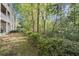 The backyard features lush greenery, a peaceful escape, and a charming patio at 2400 Cumberland Se Pkwy # 804, Atlanta, GA 30339