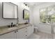 Bathroom featuring double vanity with granite countertops at 2400 Cumberland Se Pkwy # 804, Atlanta, GA 30339