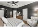 Bedroom with hardwood floors, a bookcase, and view to the bathroom at 2400 Cumberland Se Pkwy # 804, Atlanta, GA 30339