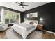 Bedroom with a ceiling fan, neutral decor, and a large window at 2400 Cumberland Se Pkwy # 804, Atlanta, GA 30339
