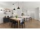 Elegant dining room with modern lighting, stylish furnishings, and open access to kitchen with bar seating at 2400 Cumberland Se Pkwy # 804, Atlanta, GA 30339
