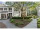 Beautiful condo complex with manicured landscaping, stone accents, and inviting walkway at 2400 Cumberland Se Pkwy # 804, Atlanta, GA 30339