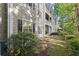 Inviting exterior showcasing well-maintained siding, black shutters and a charming outdoor space at 2400 Cumberland Se Pkwy # 804, Atlanta, GA 30339