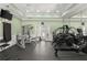 Fitness center featuring various equipment, mirrors, and television in a well-lit space at 2400 Cumberland Se Pkwy # 804, Atlanta, GA 30339
