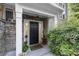 Charming front door with stone accents and manicured landscaping, creating an inviting entrance to the home at 2400 Cumberland Se Pkwy # 804, Atlanta, GA 30339