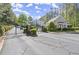 Gated entrance to the community featuring lush greenery, and well-maintained landscaping at 2400 Cumberland Se Pkwy # 804, Atlanta, GA 30339