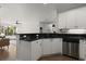 Modern kitchen with stainless steel appliances, dark countertops, and white cabinets at 2400 Cumberland Se Pkwy # 804, Atlanta, GA 30339