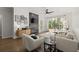 Bright living room with a modern fireplace, plush seating, and a large window offering natural light and peaceful views at 2400 Cumberland Se Pkwy # 804, Atlanta, GA 30339