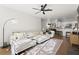 Bright living room open to the kitchen and dining room, featuring comfortable seating and modern decor at 2400 Cumberland Se Pkwy # 804, Atlanta, GA 30339
