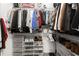 Organized walk-in closet featuring shelving and storage solutions for clothing and accessories at 2400 Cumberland Se Pkwy # 804, Atlanta, GA 30339