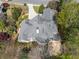 An aerial view displaying the size of the home, the roof and mature tree coverage at 315 Stanyan Pl, Alpharetta, GA 30022