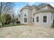Spacious backyard features a stone patio, playset, and well-maintained lawn, perfect for entertaining at 315 Stanyan Pl, Alpharetta, GA 30022