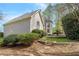 Landscaped backyard featuring a playground and mature shrubbery at 315 Stanyan Pl, Alpharetta, GA 30022
