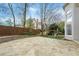 Large backyard features a stone patio, a basketball hoop, and a playset for outdoor fun at 315 Stanyan Pl, Alpharetta, GA 30022