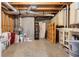 Unfinished basement area with exposed ductwork and concrete floor, offering ample storage space at 315 Stanyan Pl, Alpharetta, GA 30022
